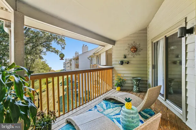 a view of balcony with furniture