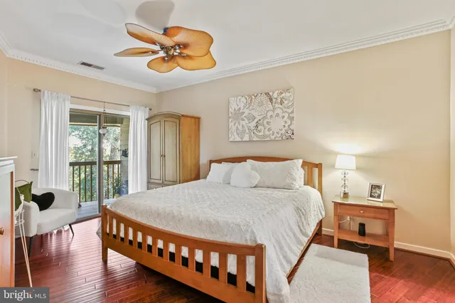 a bedroom with a bed and a table in it