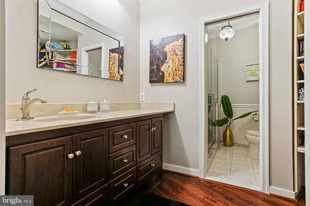 a bathroom with a sink a vanity and mirror