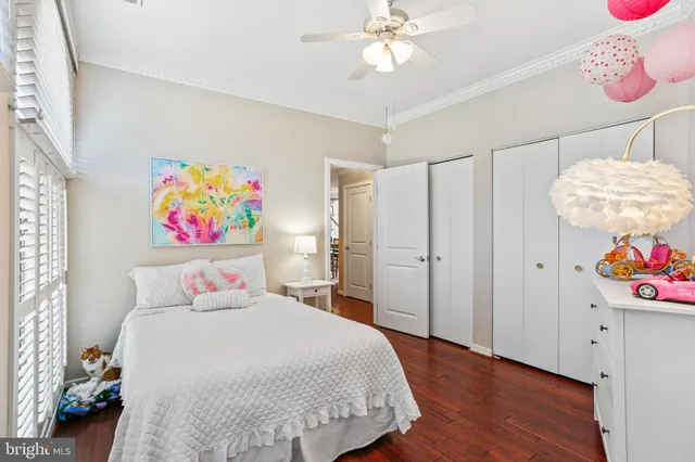 a bedroom with a bed and cabinets