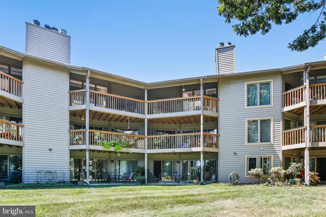 a front view of a building with a garden