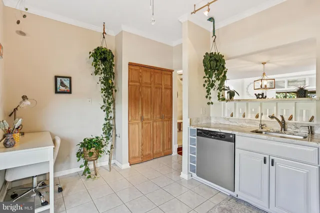 a kitchen with a sink and refrigerator