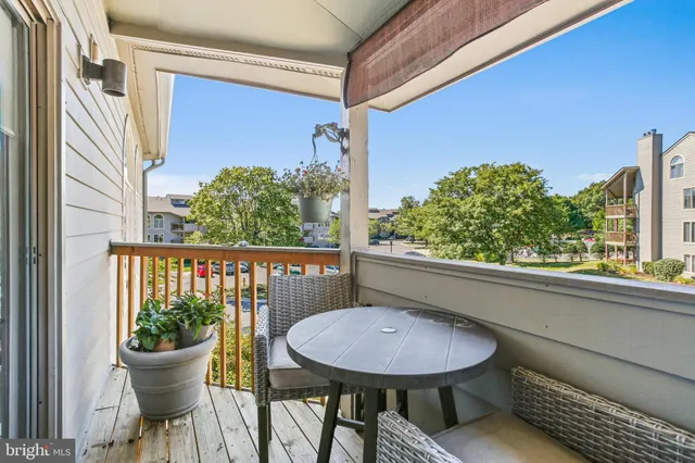 a view of a chair and table in the balcony
