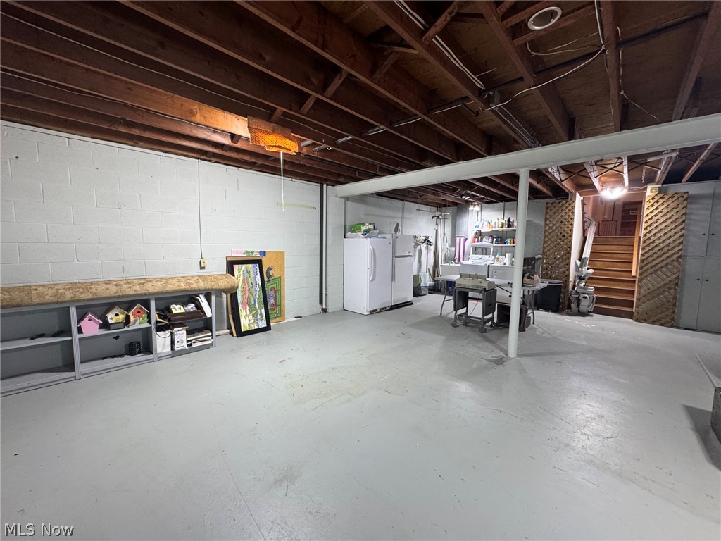 296 Fairfield Road Painesville, OH 44077 - Photo 39 of 48 Spacious basement with concrete flooring, laundry area and plenty of storage