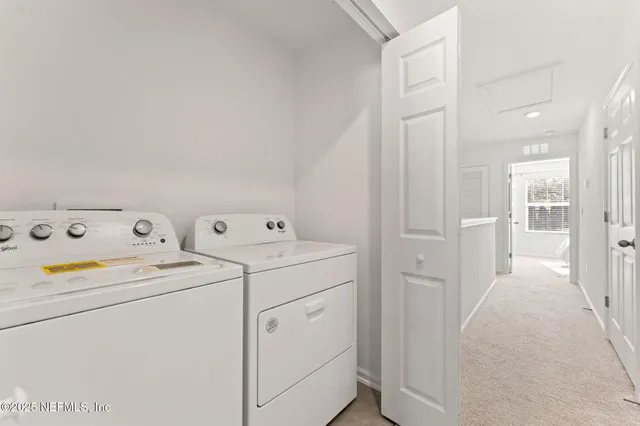 a utility room with dryer and washer