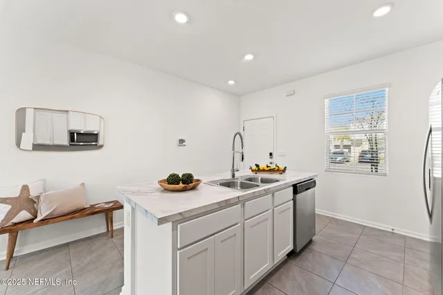 a view of a kitchen with appliances and cabinets