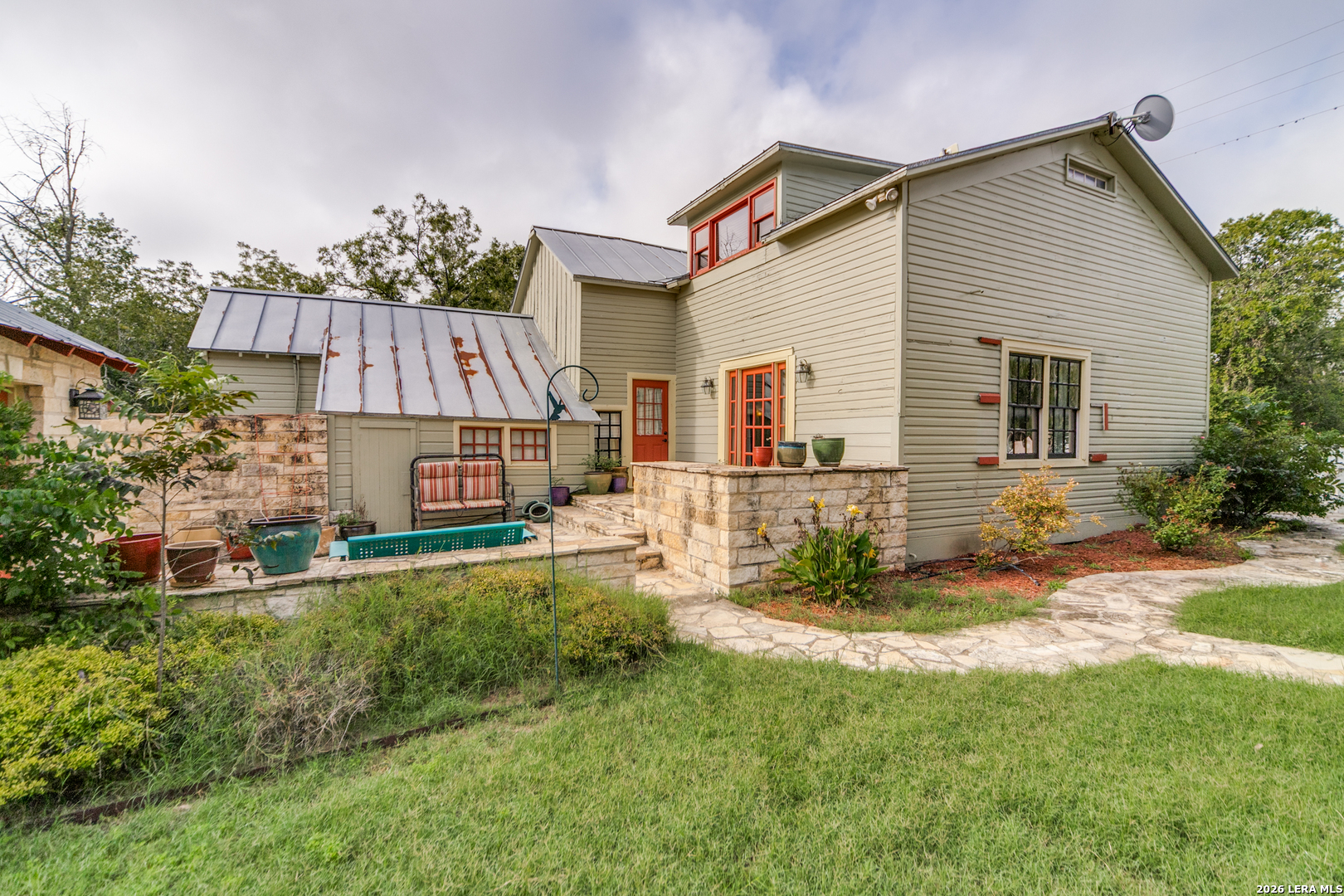 1201 Sisterdale Road Boerne, TX 78006 - Photo 12 of 17 a view of a house with a yard and sitting area