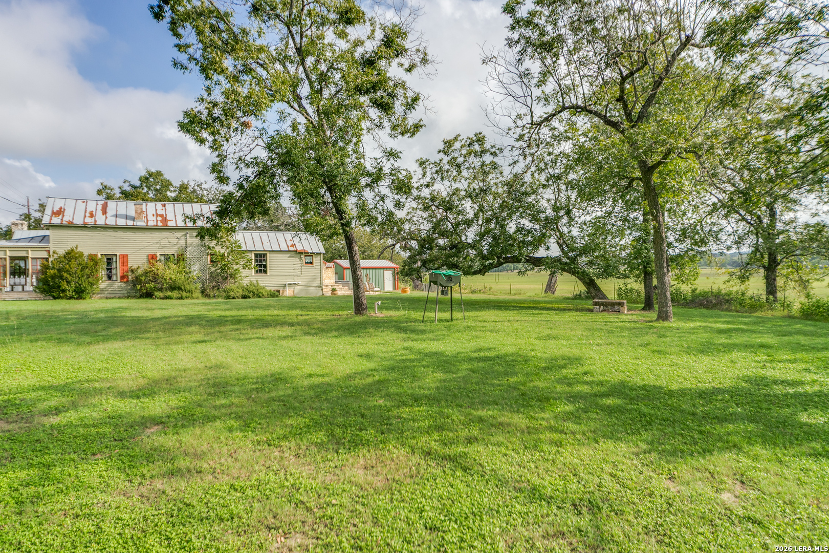 1201 Sisterdale Road Boerne, TX 78006 - Photo 15 of 17 a huge green field with lots of trees