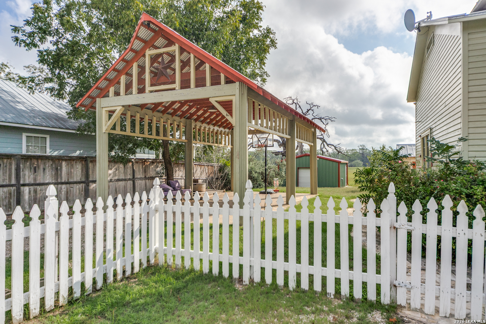 1201 Sisterdale Road Boerne, TX 78006 - Photo 17 of 17 a front view of a house with a garden
