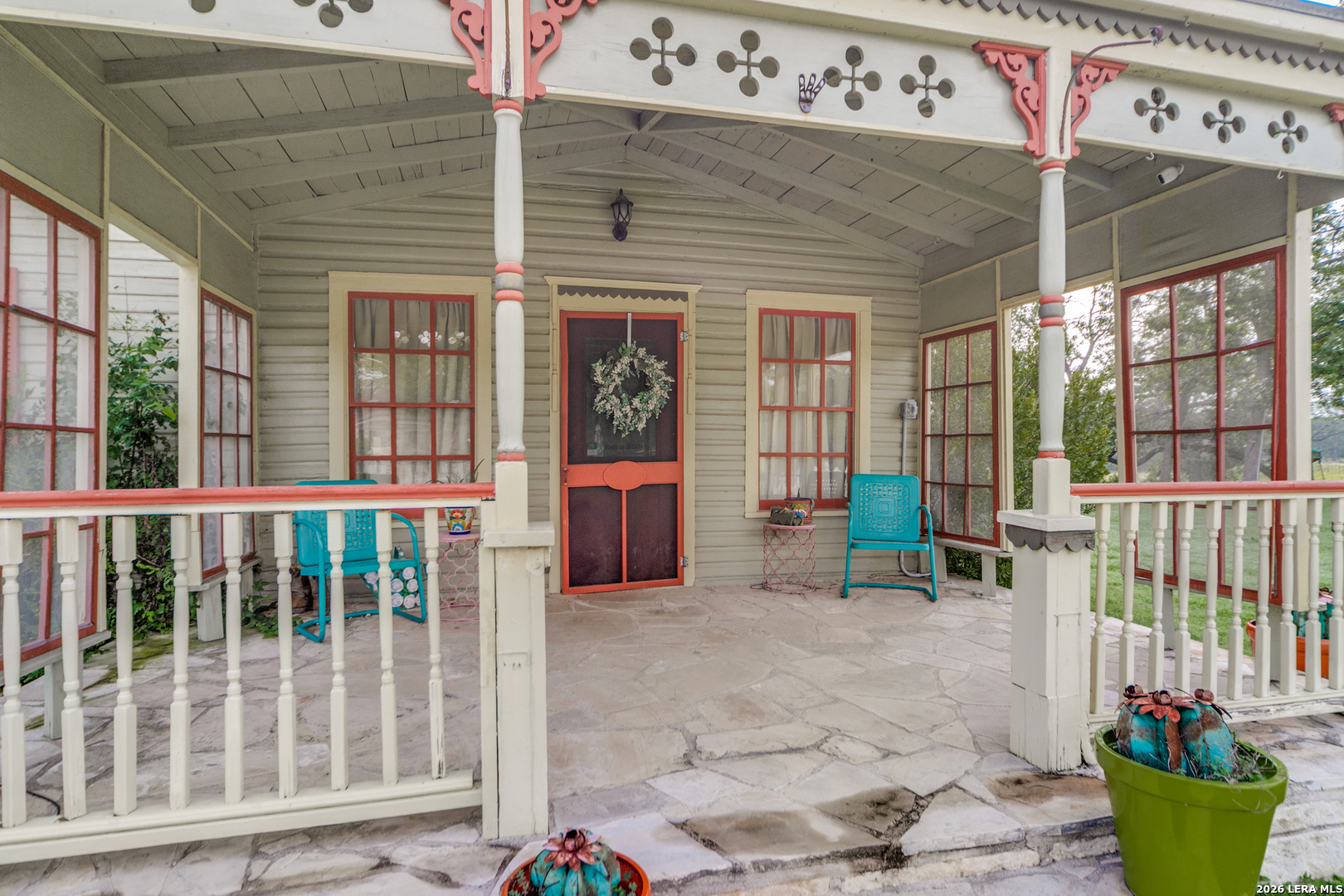 1201 Sisterdale Road Boerne, TX 78006 - Photo 2 of 17 a view of a patio with table and chairs and potted plants