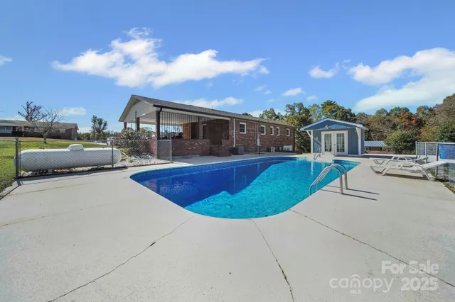 a view of a swimming pool with a patio