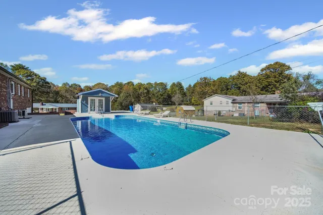 a view of a swimming pool with an outdoor seating