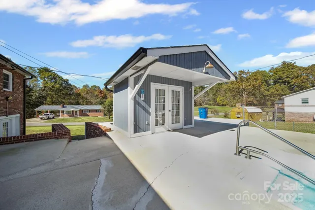 a view of a house with a swimming pool