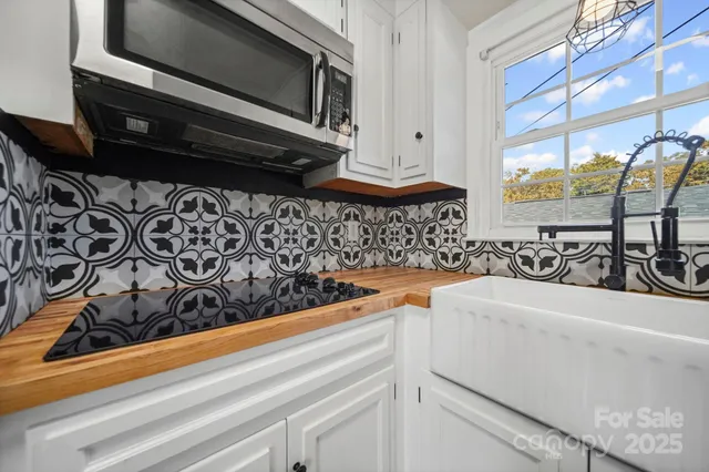 a view of a sink and a microwave