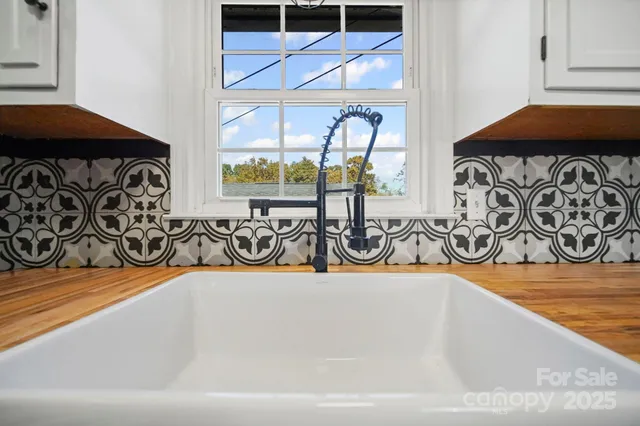 a view of a patio with a table and chairs