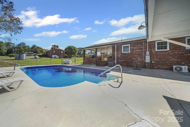 a view of a swimming pool with lounge chair