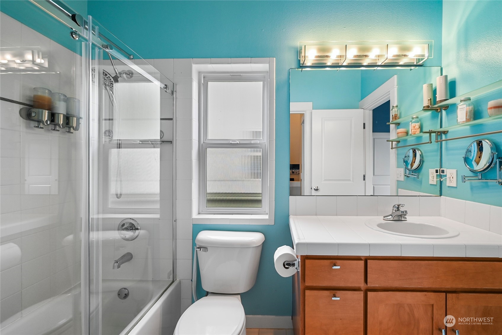 4408 Meridian Avenue North, Unit A Seattle, WA 98103 - Photo 16 of 31 a bathroom with a sink toilet and shower