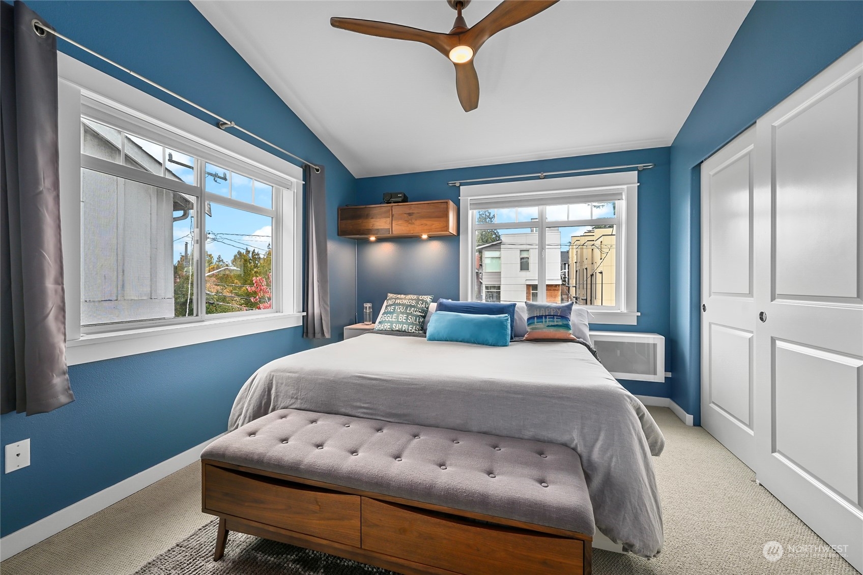 4408 Meridian Avenue North, Unit A Seattle, WA 98103 - Photo 17 of 31 a bedroom with a bed and windows