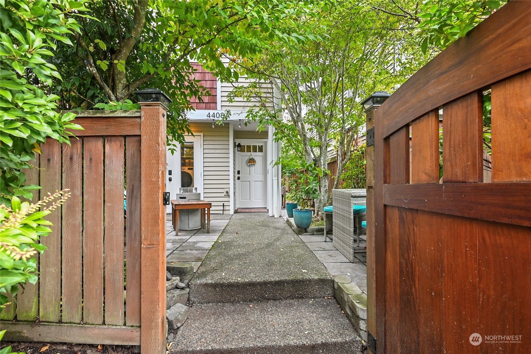 4408 Meridian Avenue North, Unit A Seattle, WA 98103 - Photo 27 of 31 a view of house with backyard and sitting area