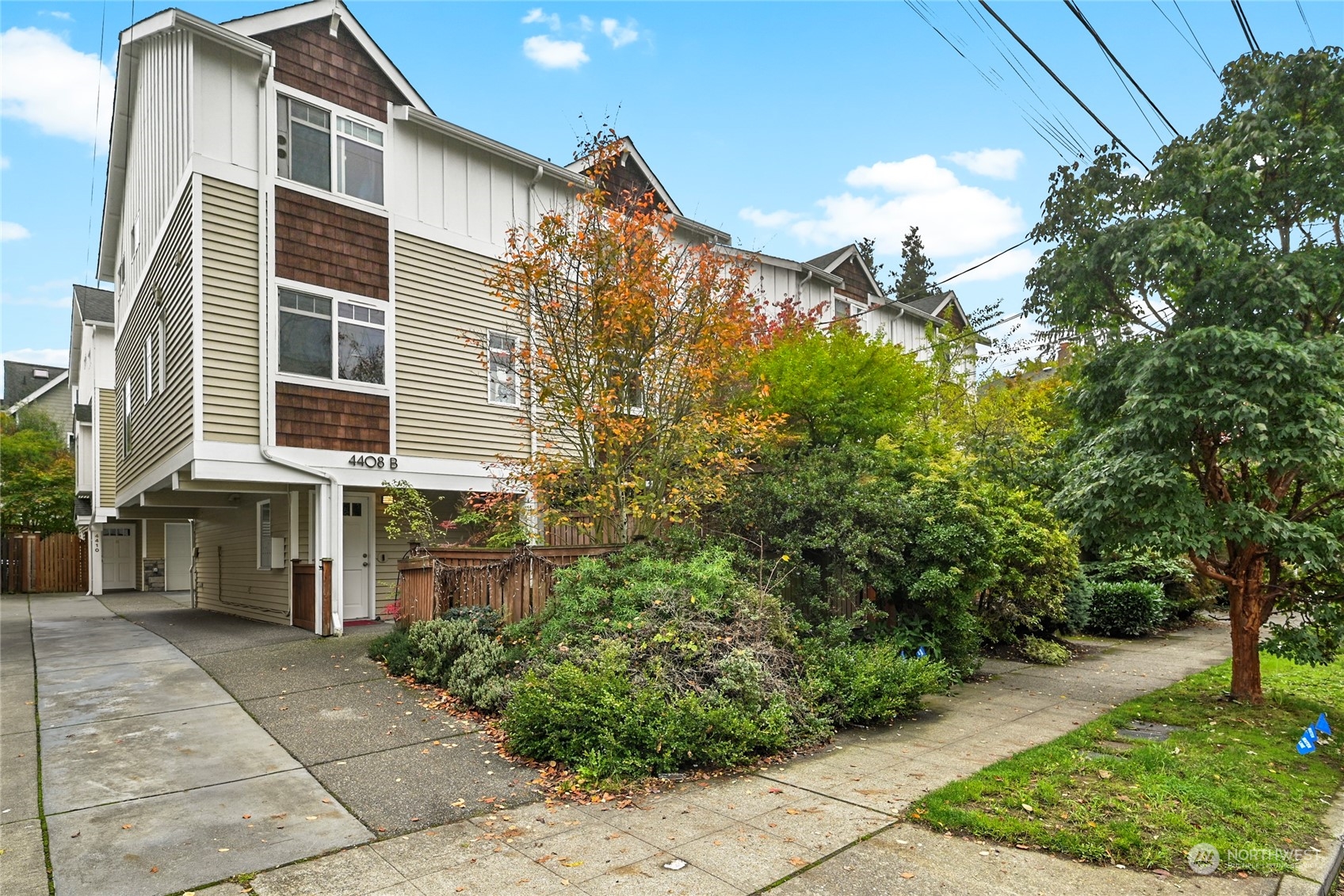 4408 Meridian Avenue North, Unit A Seattle, WA 98103 - Photo 30 of 31 a front view of a house with a yard