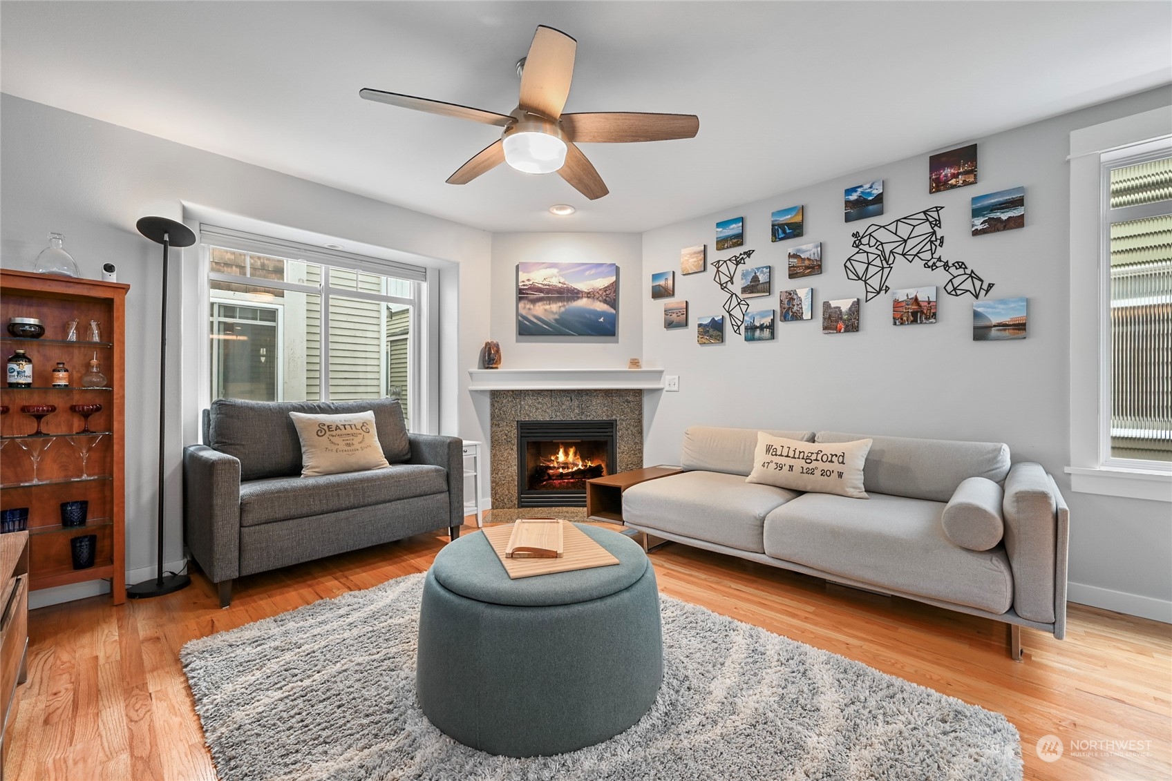 4408 Meridian Avenue North, Unit A Seattle, WA 98103 - Photo 3 of 31 a living room with furniture and a fireplace