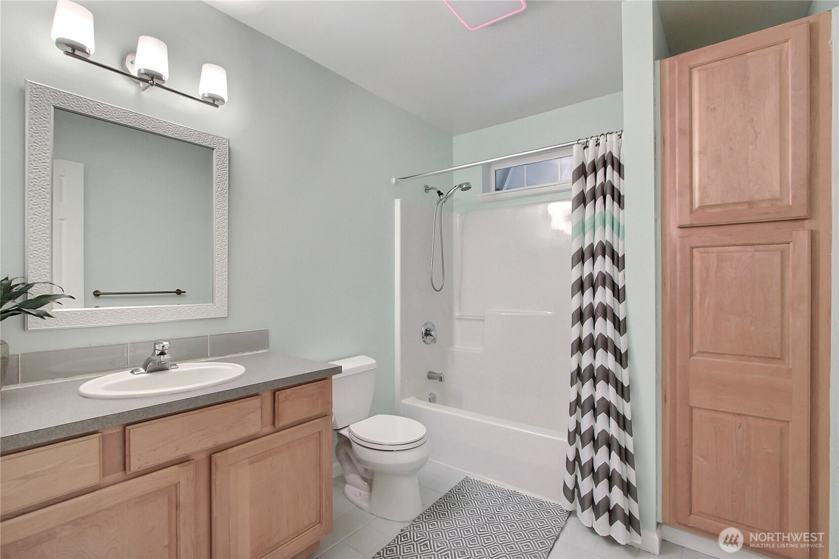 3841 Mari Lane Southeast Olympia, WA 98513 - Photo 13 of 24 a bathroom with a sink toilet and shower