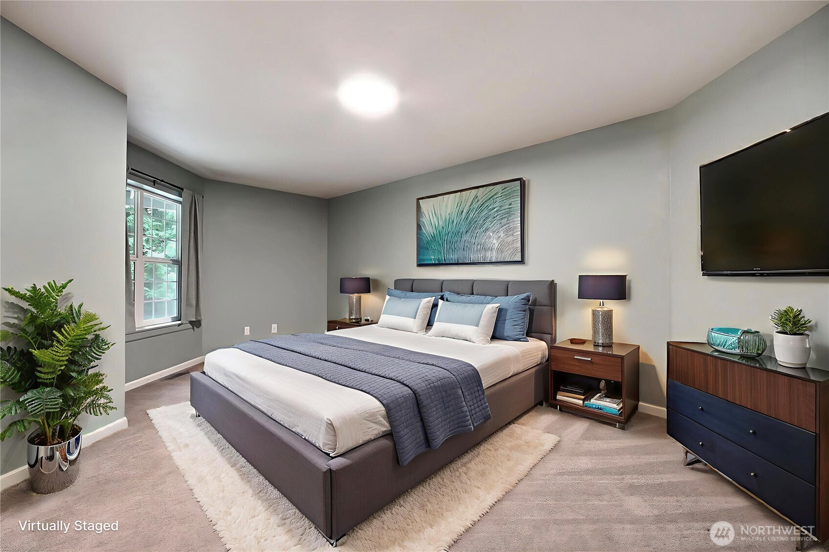 3841 Mari Lane Southeast Olympia, WA 98513 - Photo 14 of 24 a spacious bedroom with a bed and a flat screen tv