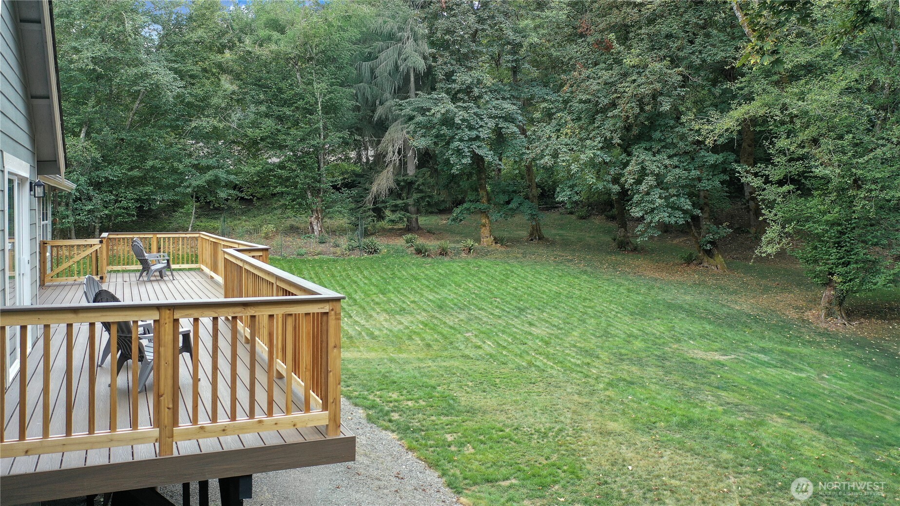 3841 Mari Lane Southeast Olympia, WA 98513 - Photo 18 of 24 a view of backyard with two chairs and a trees