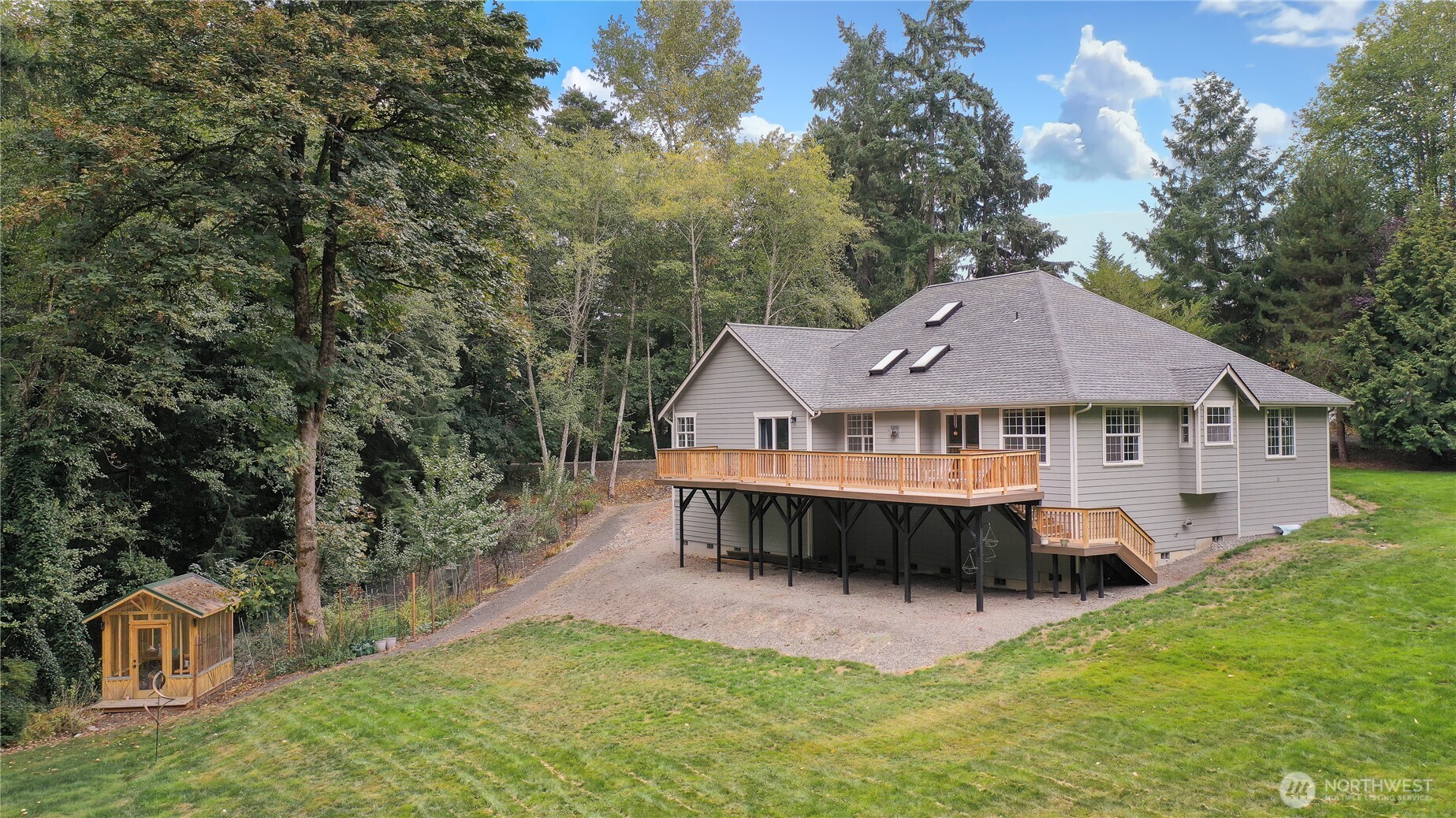 3841 Mari Lane Southeast Olympia, WA 98513 - Photo 19 of 24 a view of a house with a big yard and large tree