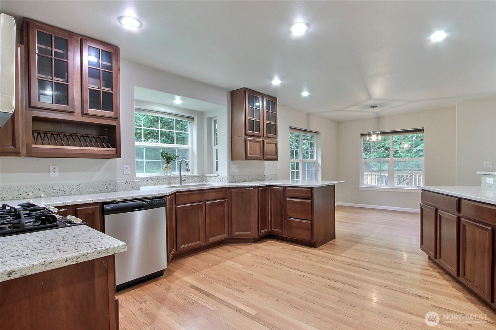 3841 Mari Lane Southeast Olympia, WA 98513 - Photo 5 of 24 a large kitchen with stainless steel appliances granite countertop a stove and a sink