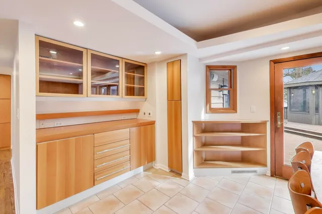 a view of a kitchen with a sink and a refrigerator