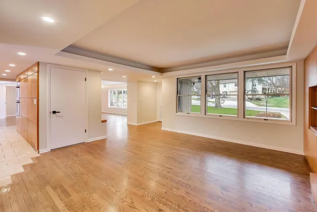 a living room with furniture potted plant and a large mirror