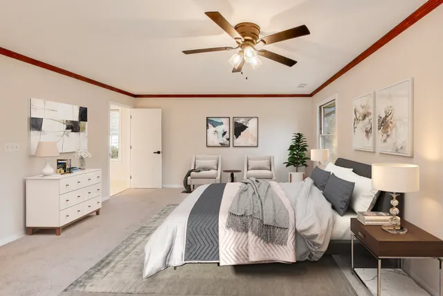 a bedroom with a large bed and a couch