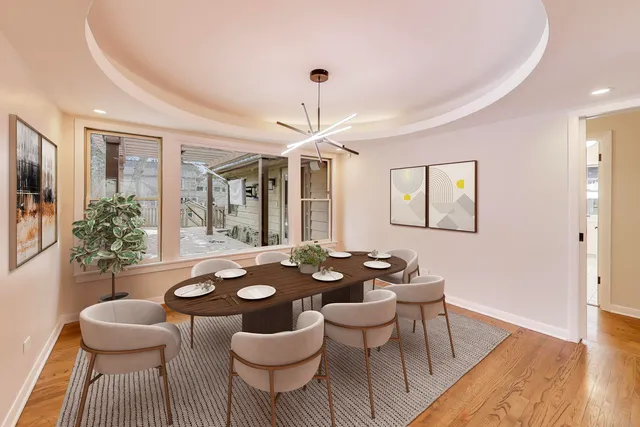 a kitchen with stainless steel appliances kitchen island granite countertop a refrigerator and cabinets