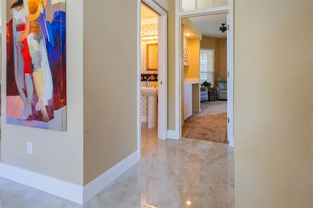 a bathroom with a granite countertop window and a sink