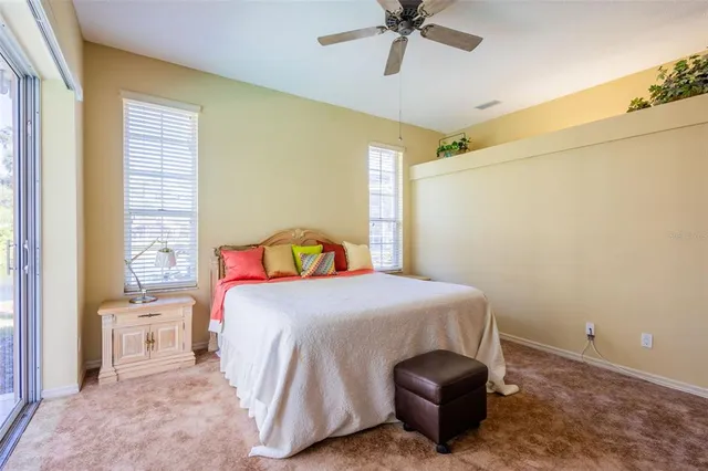 a dining room with furniture a fireplace and wooden floor