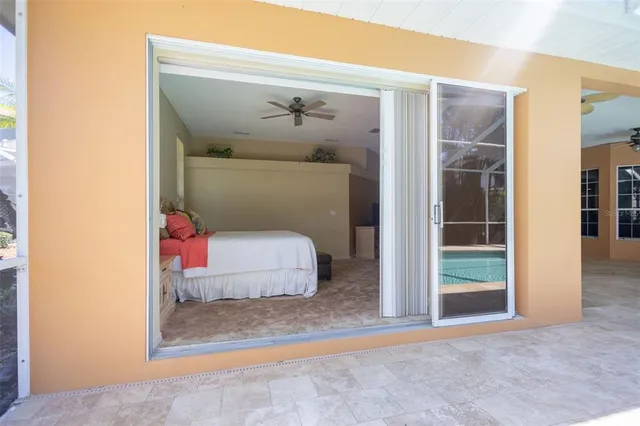 a view of a livingroom with furniture a ceiling fan and wooden floor