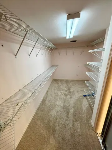 a view of a livingroom with a dishwasher and a window