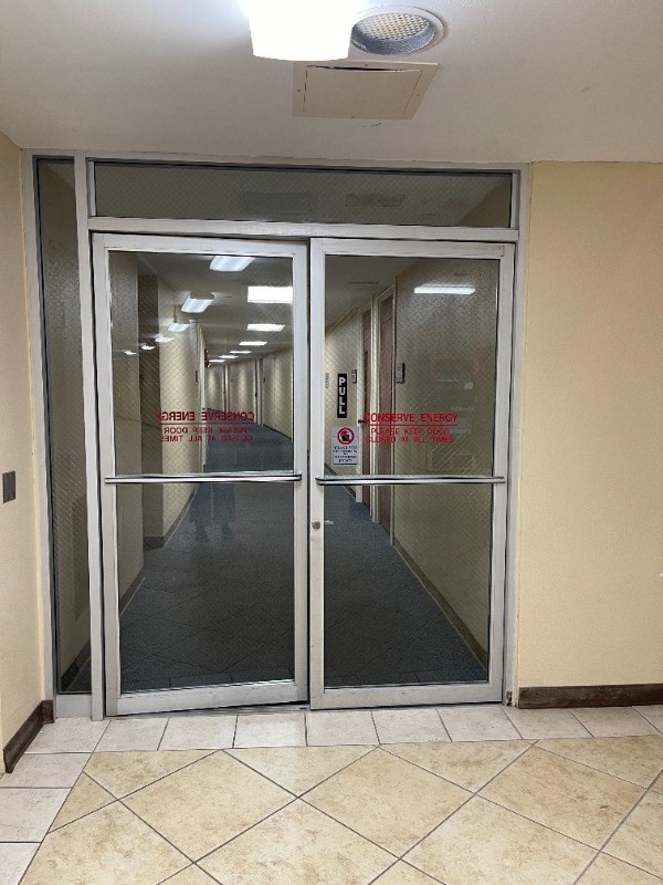 101 Aupuni Street, Unit 119 Hilo, HI 96720 - Photo 5 of 23 Commercial office side has doubled glass door on one side and locked doors on the other. These doors are locked during non business hours for added security.