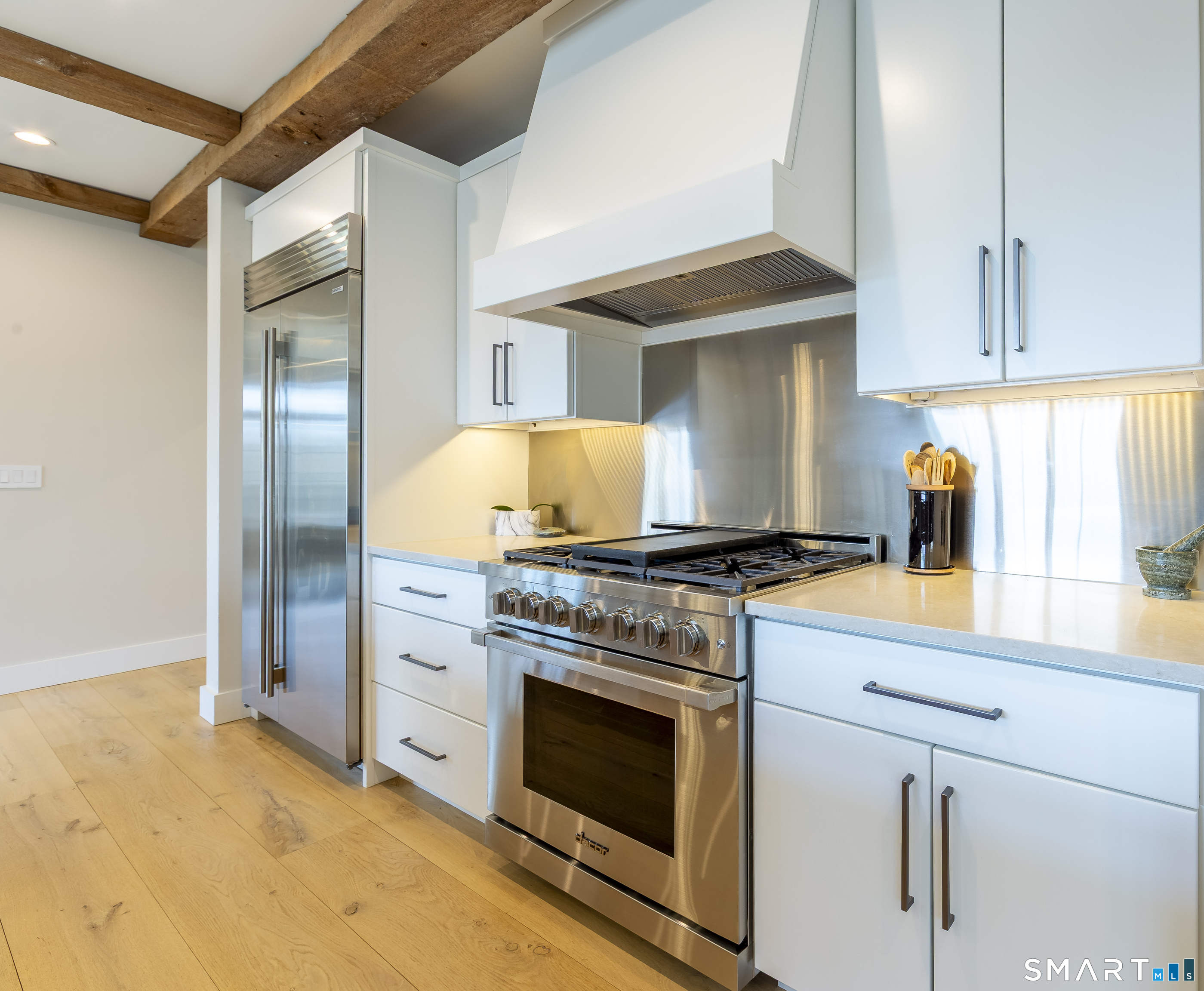 5 Upland Pastures Road Sherman, CT 06784 - Photo 15 of 40 Chef's kitchen outfitted with premium stainless-steel appliances, Dacor 36" gas pro range with 6 burners with ventilation system above.