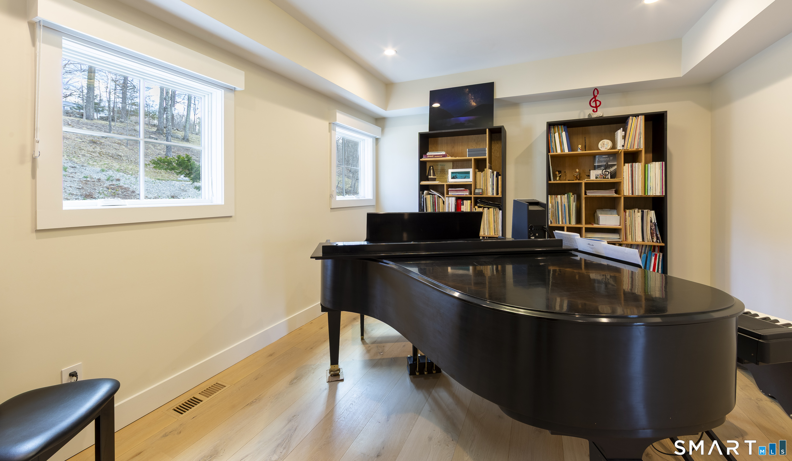 5 Upland Pastures Road Sherman, CT 06784 - Photo 18 of 40 A music room with a tray ceiling provides an ideal setting for a home office or formal dining space.