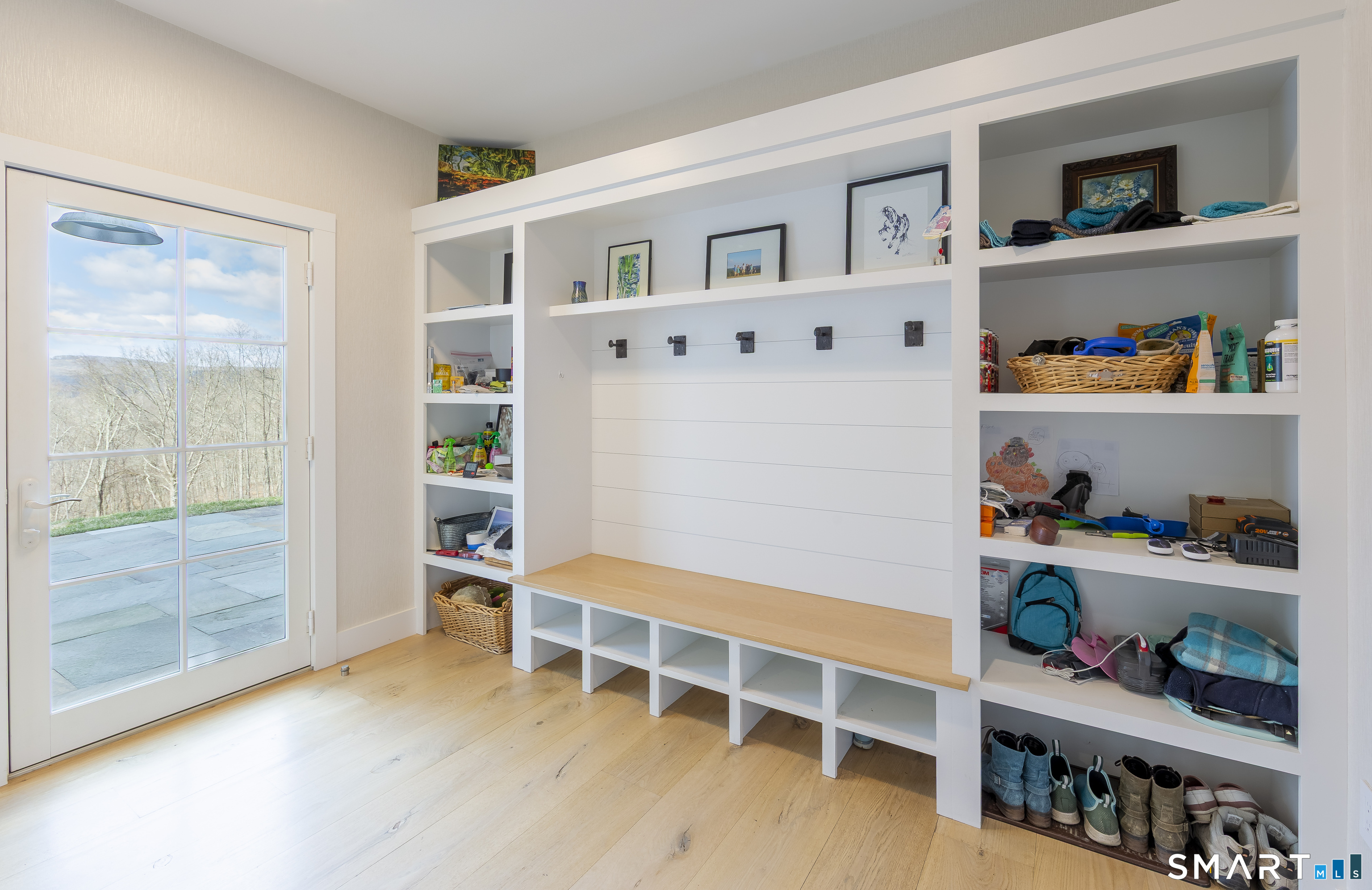 5 Upland Pastures Road Sherman, CT 06784 - Photo 24 of 40 An expansive mudroom with custom cabinetry with doors to both the side patio and two car garage.