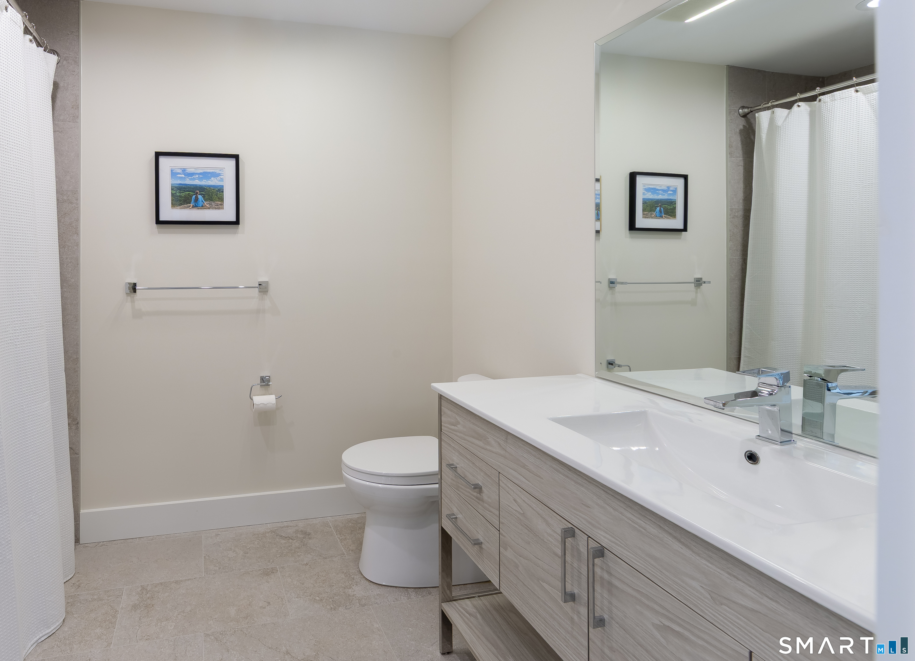5 Upland Pastures Road Sherman, CT 06784 - Photo 29 of 40 Full hall bath for bedrooms #3 and #4 with tub and tile surround, Toto toilet, 48" vanity and white pine shelving for a linen closet.