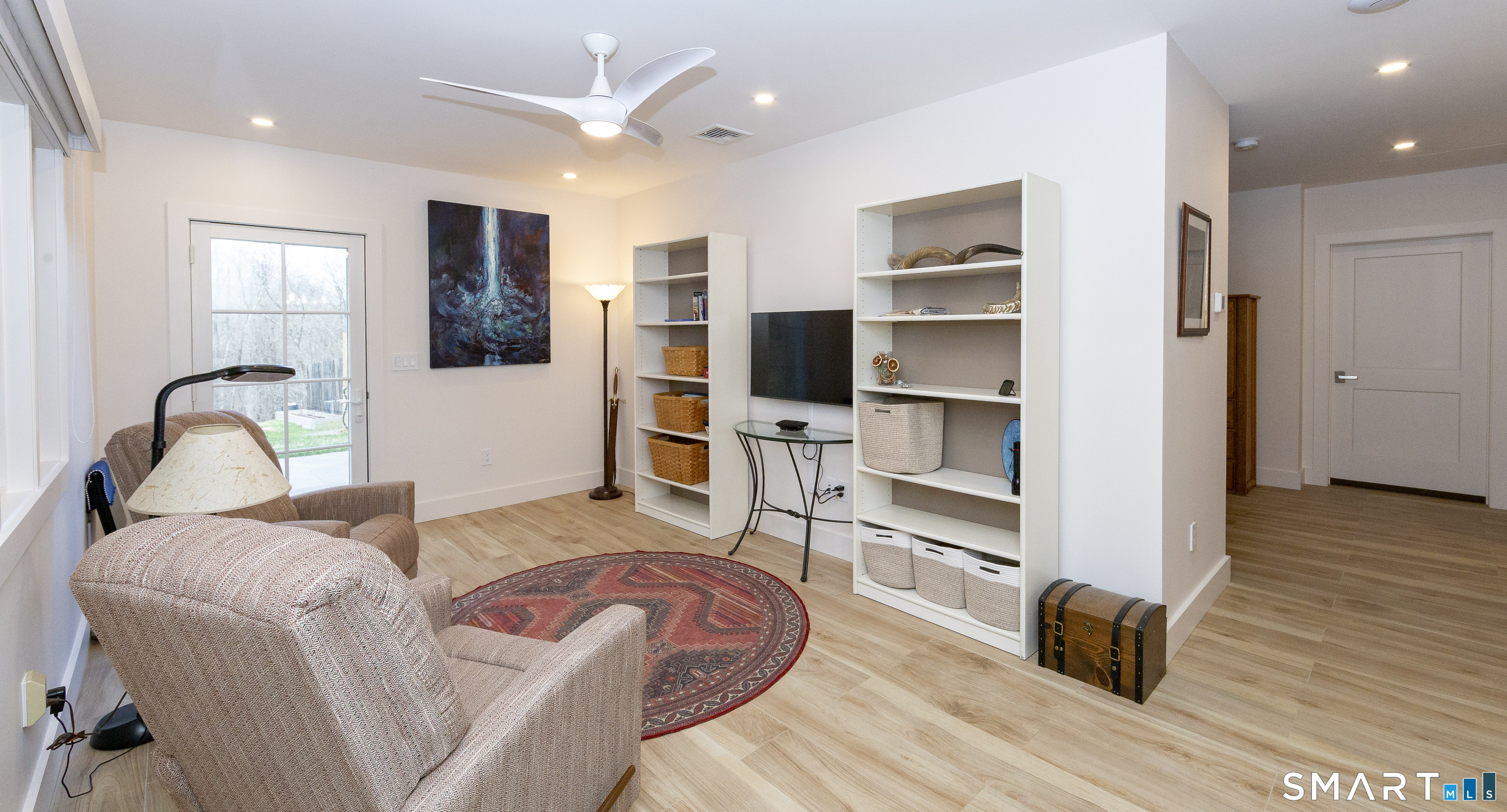 5 Upland Pastures Road Sherman, CT 06784 - Photo 32 of 40 In 2023, a beautifully designed 750 SF legal accessory apartment was added, offering its own private entrance and parking area. This self-contained space includes a living room.