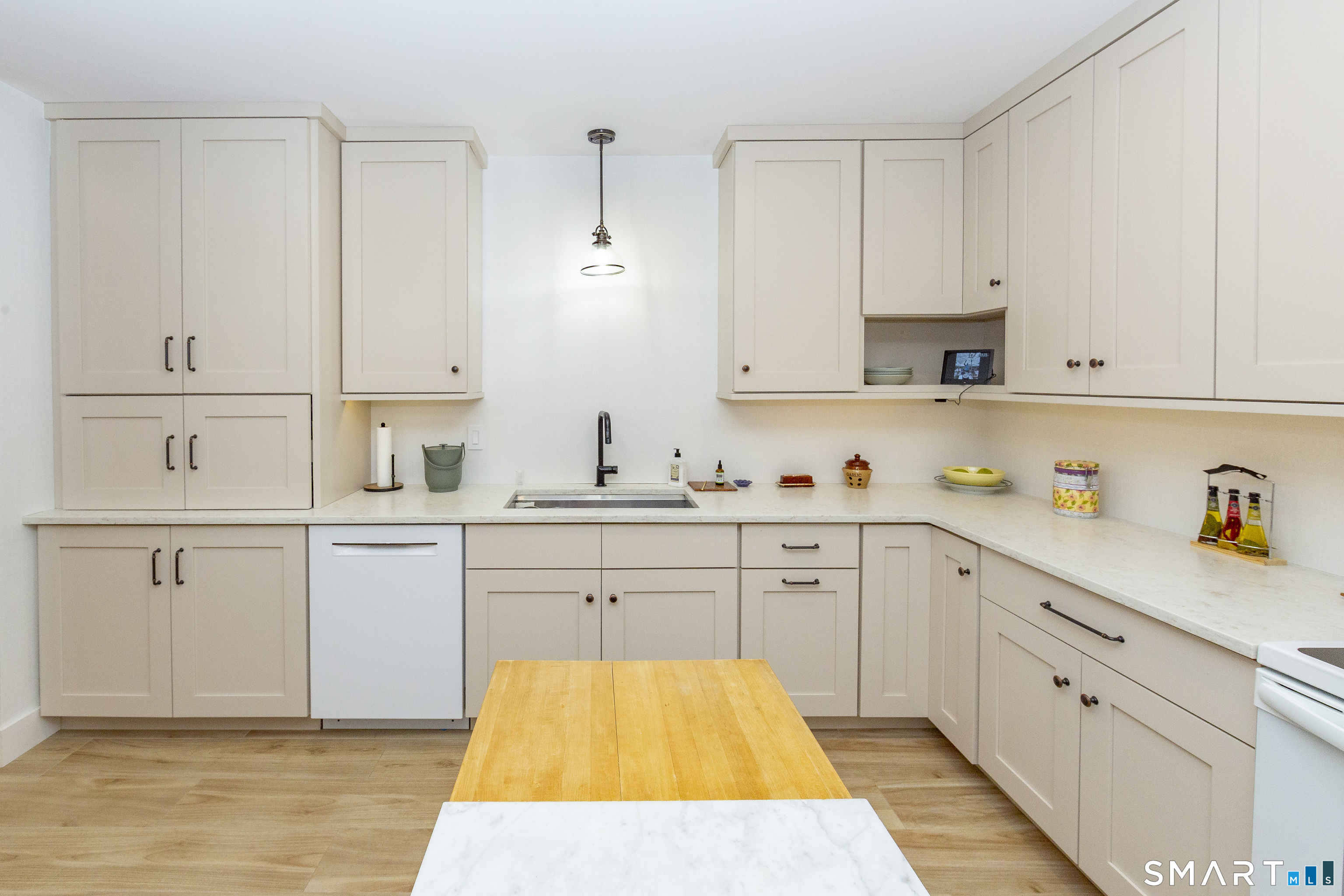 5 Upland Pastures Road Sherman, CT 06784 - Photo 34 of 40 Very large kitchen outfitted with custom cabinetry, quartz counters and built-in table with matching tabletop.