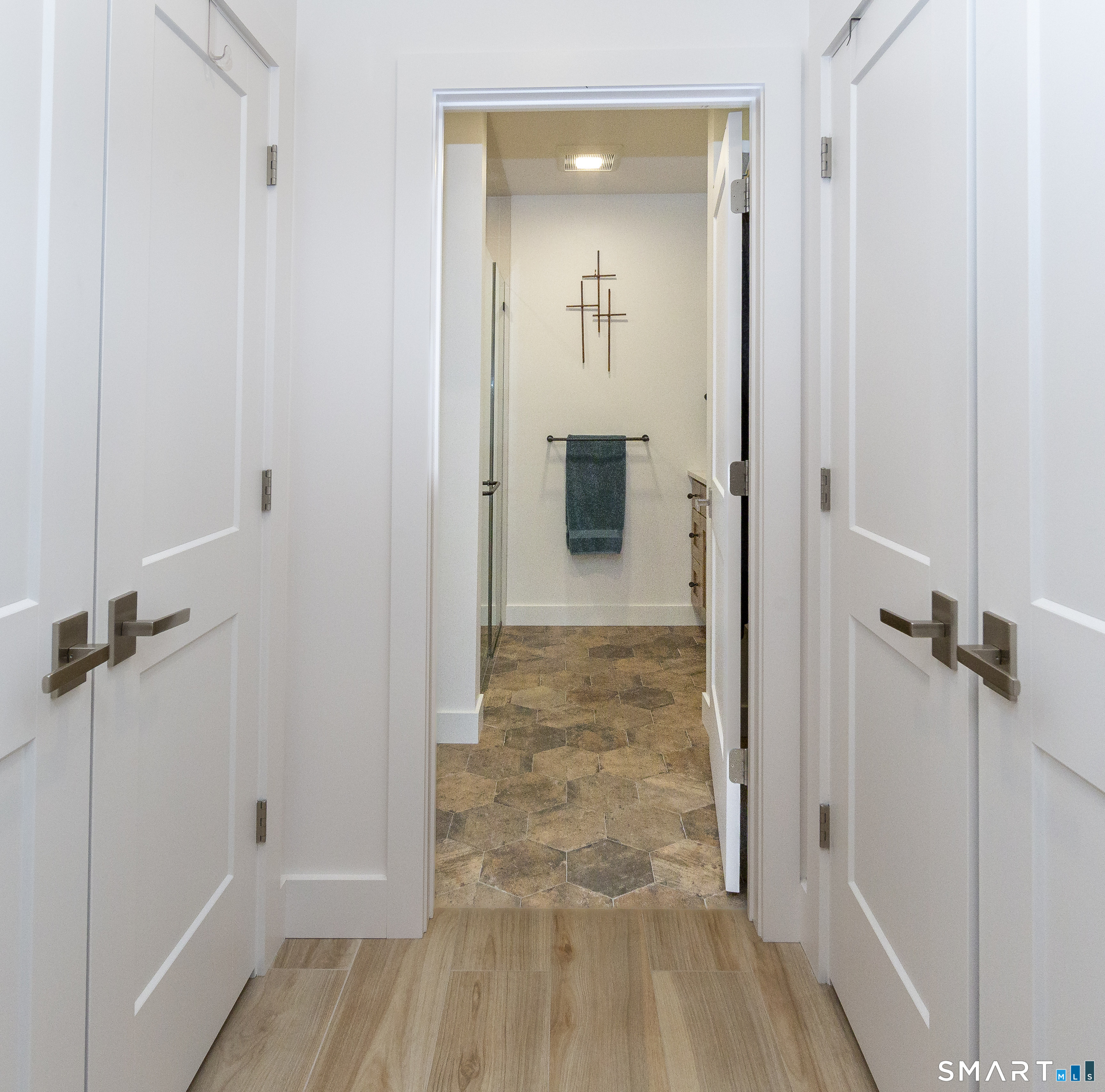 5 Upland Pastures Road Sherman, CT 06784 - Photo 36 of 40 Dual closets, bathroom with hexagon tiled floor, mission style vanity, double glass walk-in shower, and Toto toilet.
