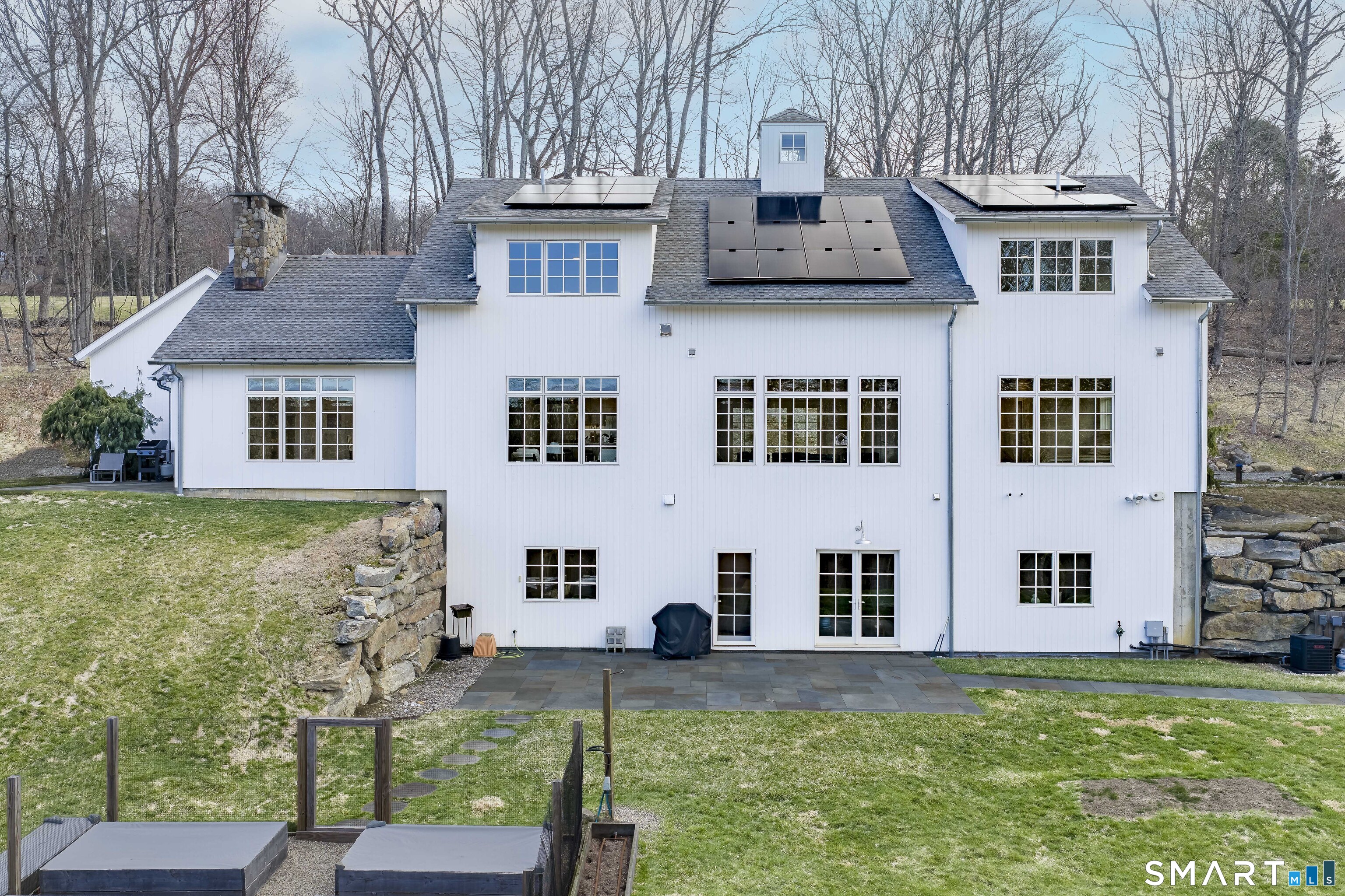 5 Upland Pastures Road Sherman, CT 06784 - Photo 4 of 40 Designed with efficiency and sustainability in mind, the home is equipped with top-tier mechanical systems, a full-house generator, and discreet solar panels that significantly reduce energy costs.