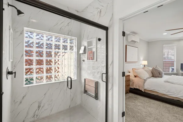 a en suite bathroom with a bathtub and shower