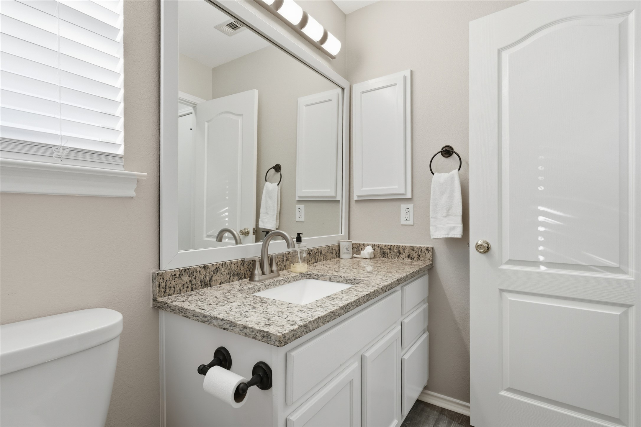 13922 Jubilee Way Helotes, TX 78023 - Photo 14 of 27 Half bath featuring vanity and toilet