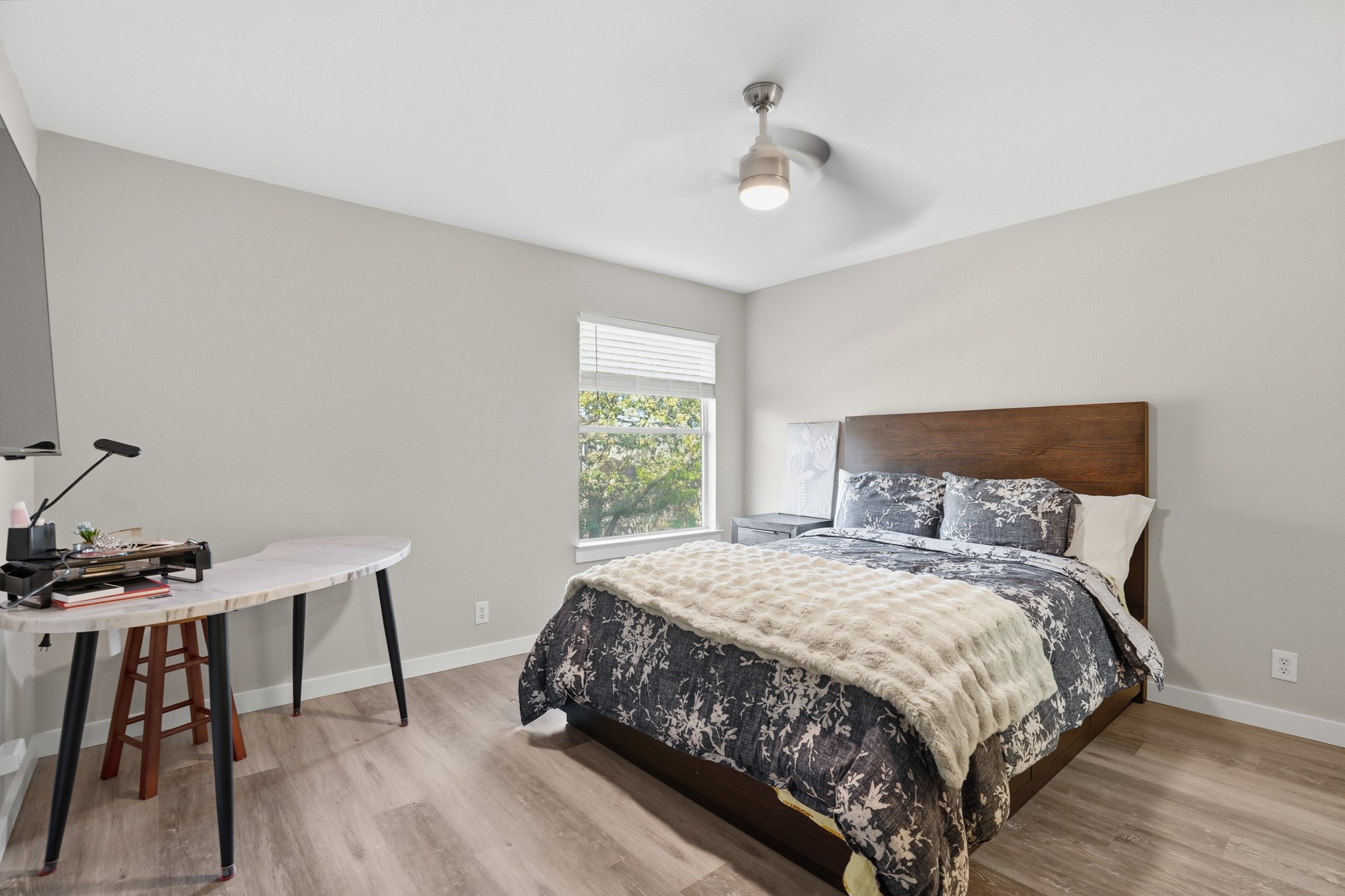 13922 Jubilee Way Helotes, TX 78023 - Photo 17 of 27 Bedroom with light wood-style floors and a ceiling fan
